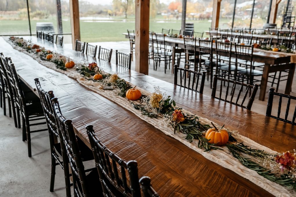 The best month to get married in Upstate NY is fall because you can decorate your long, wooden tables with greenery and pumpkins in an outdoor venue